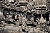 Prambanan - Candi Lara Jonggrang, miniature shrines surmounted by small fluted stupa with panels with musicians and dancers decorating the top of the balustrade 